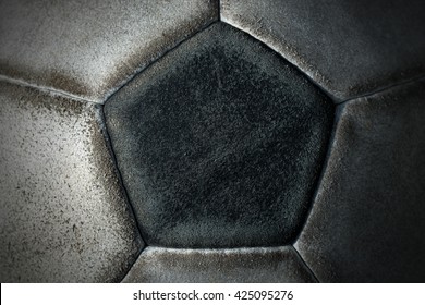 Macro Photo Of An Old Black And White Soccer Ball With Pentagons And Hexagons In Leather