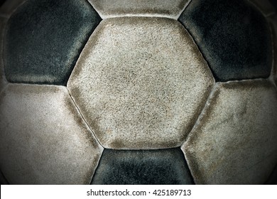 Macro Photo Of An Old Black And White Soccer Ball With Hexagons And Pentagons In Leather