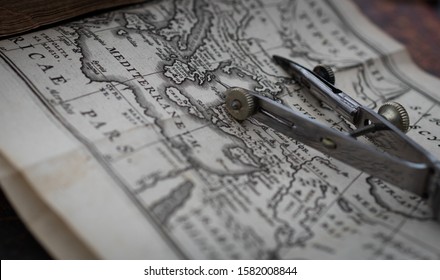 Macro Photo Of  Old Vintage Calipers On A Map Page Of The Eastern Mediterranean From An Authentic 17th Century Book. Close Up, Vintage Travel Concept