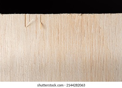 Macro Photo Of Plywood Edge Over A Black Background