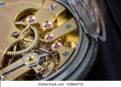Macro photo of a pocket watch movement , cogwheels and clockwork
