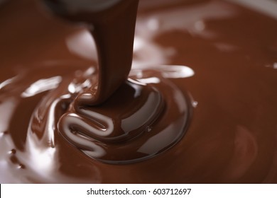 Macro Photo Of Premium Dark Chocolate Pour In Bowl, Shallow Focus