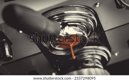 Macro photo Process professional espresso pouring from coffee machine in cafe, warm toning.