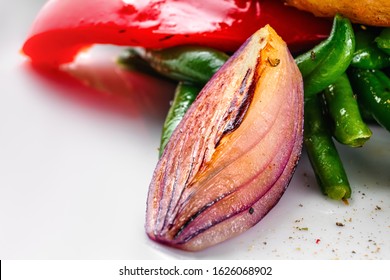 Macro Photo Of Roasted Red Onion As Part Of Vegetable Salad