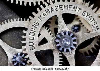 Macro Photo Of Tooth Wheel Mechanism With BUILDING MANAGEMENT SYSTEM Concept Letters