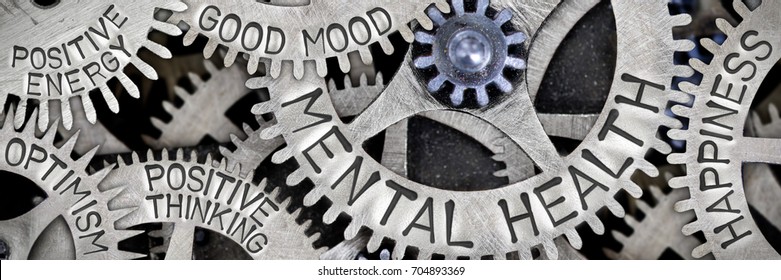 Macro photo of tooth wheel mechanism with MENTAL HEALTH, HAPPINESS, GOOD MOOD, POSITIVE THINKING, POSITIVE ENERGY and OPTIMISM letters imprinted on metal surface
