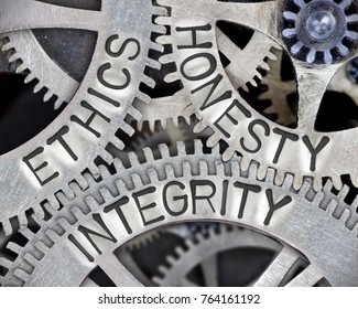 Macro photo of tooth wheel mechanism with ETHICS, HONESTY and INTEGRITY words imprinted on metal surface - Shutterstock ID 764161192