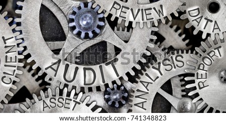 Macro photo of tooth wheel mechanism with AUDIT, ANALYSIS, REVIEW, DATA, REPORT, CLIENT and ASSET words imprinted on metal surface