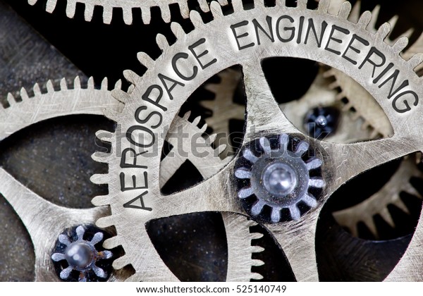 Macro photo of tooth wheel mechanism with\
AEROSPACE ENGINEERING concept\
letters