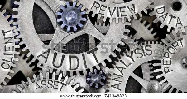 Macro photo of tooth wheel mechanism with AUDIT,\
ANALYSIS, REVIEW, DATA, REPORT, CLIENT and ASSET words imprinted on\
metal surface