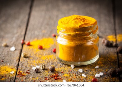 Macro Photo Of Turmeric Powder With Spices. Yellow Curry.