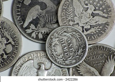 Macro Photo Of Vintage US Quarters And Dimes Showing American Eagle