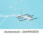 macro photo of a white pin needle into Kapolei city of Hawaii island of United States of America political map