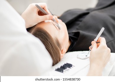 Macro Photo Woman With Long Lashes In Beauty Salon. Concept Eyelash Extension Procedure.