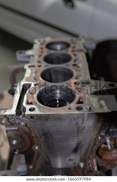 Macro photograph of the cylinder block of a\
combustion engine, car\
mechanics