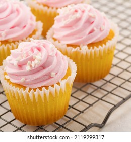 Macro Photography. Appetizing Cupcakes With Creamy Fruit Whipped Cream. Birthday Invitation, Holiday, Anniversary, Postcard, Advertisement, Banner. There Are No People In The Photo.