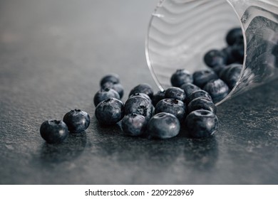 Macro Photography, Blueberries Scattered On A Dark Surface.