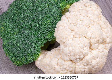 Macro Photography. Close Shot Of Green Broccoli And White Calliflower On Grey Surface.