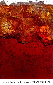Macro photography of a glass of cola soft drink with ice.