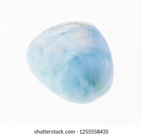 macro photography of natural mineral from geological collection - polished larimar (stefilia stone) gem on white background - Shutterstock ID 1255558435