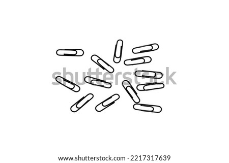 Macro photography of paper clips on white background