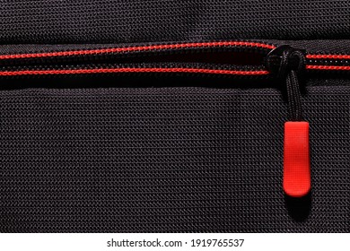 Macro Photography Of Red Zipper On Black Luggage