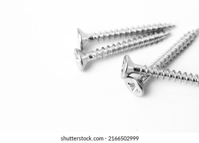 Macro Photography Of Screws On White Background