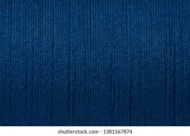 Macro picture of dark blue thread rough texture surface background