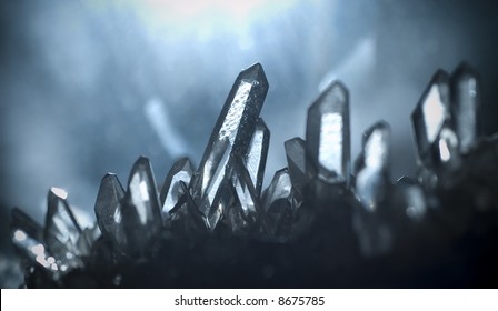 Macro Picture Of Some Quartz Gems Shot In A Cave. Natural Light Irradiates The Crystals