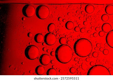 Macro red bubble texture close-up,red macro bubbles,Backgrounds, Abstract Backgrounds, Soda, Red, Carbonated,Beauty concept background. Closeup cosmetic liquid gel with bubbles on red colors backgroun