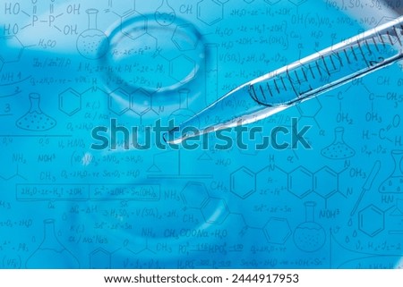 Macro science background,macro science experiment background,Laboratory research, dropping liquid to test tube. Test tube containing chemical liquid in laboratory, lab chemistry or science research an