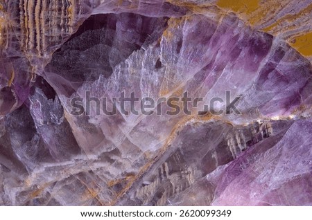 Macro shoot of fluorite stone texture. Amazing natural patterns and textures of minerals for background. High magnification of fluorite stone texture.