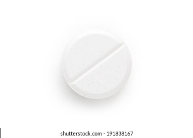 Macro shoot of single white pill isolated on white background.