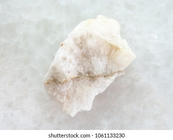 Macro Shooting Of Natural Mineral Rock Specimen - Scheelite Vein (tungsten Ore) In Raw Stone On White Marble Background