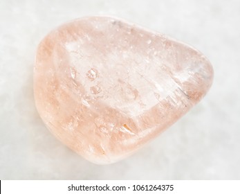 macro shooting of natural mineral rock specimen - morganite (pink beryl) gemstone on white marble background from Ural Mountains, Russia - Shutterstock ID 1061264375