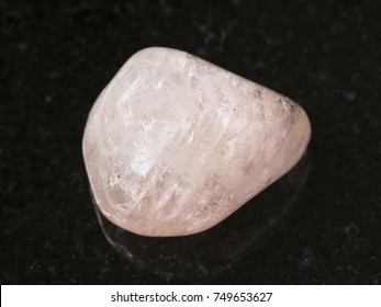 macro shooting of natural mineral rock specimen - polished morganite (pink beryl) gemstone on dark granite background from Ural Mountains, Russia - Shutterstock ID 749653627