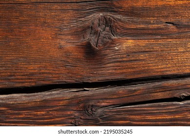 Macro Shot Of An Ancient Weathered Dark Brown Cracked Wood Beam Surface With Nice Rough Grain Texture.