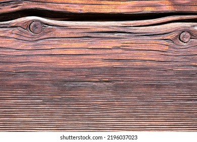 Macro Shot Of An Ancient Weathered Dark Brown Cracked Wood Beam Surface With Nice Rough Grain Texture.