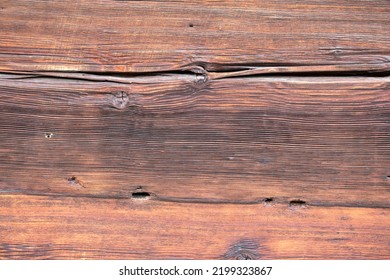 Macro Shot Of An Ancient Weathered Dark Brown Cracked Wood Beam Surface With Nice Rough Grain Texture.