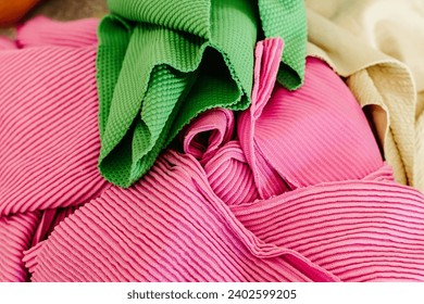A macro shot of an array of vibrant fabrics, displaying an array of bright colors