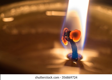 Macro Shot Of A Candle Wick And Flame