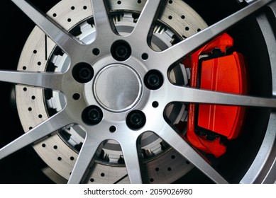 A Macro Shot Of A Car Wheel Rim With Multiple Metallic Joints