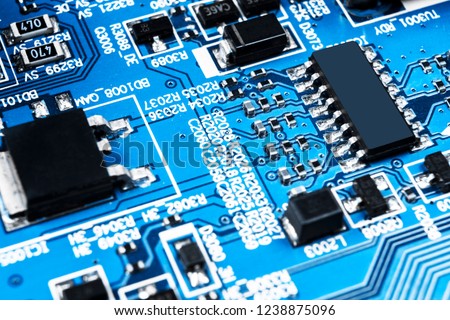 Macro shot of a Circuitboard with resistors microchips and electronic components. Computer hardware technology. Integrated communication processor. Information engineering. Semiconductor. PCB. Closeup