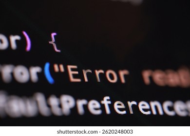 A macro shot of a computer screen displaying lines of code, with the word "Error" prominently visible. The image highlights software issues, debugging, or the challenges of programming