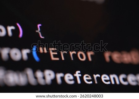 A macro shot of a computer screen displaying lines of code, with the word "Error" prominently visible. The image highlights software issues, debugging, or the challenges of programming