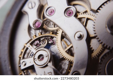 macro shot of details of an old Swiss watch, small gears, springs and clock mechanism close-up - Powered by Shutterstock