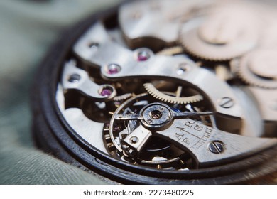 macro shot of details of an old Swiss watch, small gears, springs and clock mechanism close-up - Powered by Shutterstock