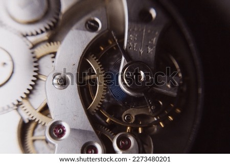 macro shot of details of an old Swiss watch, small gears, springs and clock mechanism close-up
