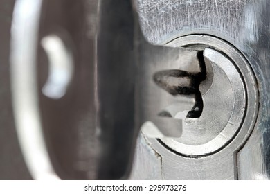 Macro Shot Of Door Lock Keyhole With Key