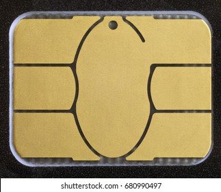 Macro shot of electronic chip on a credit card or debit card. Image for technology or finance background.